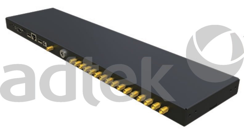 ADTEK Fiber Optic Tracing Solutions long black rectangular multi-port device chassis or RFID reader enclosure featuring row of gold-colored FC SC style fiber optic connector ports along front edge, power interface and indicator lights on rear side, white background with large gray adtek logo watermark, 792x427 pixel resolution