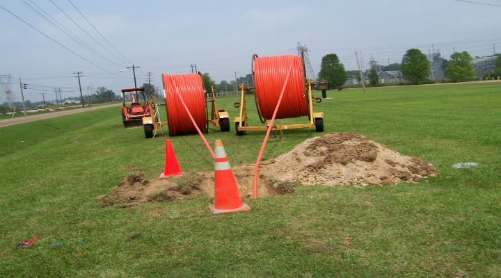 Field deployment of fiber-optic cable.