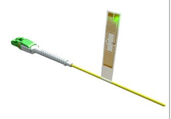 Yellow fiber optic patch cable with green connector and attached label